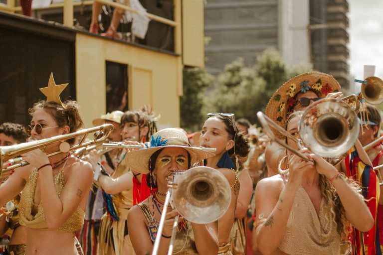 Colorful street parade featuring musicians and festive costumes, embracing celebration and joy.